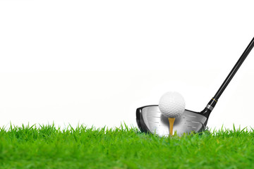 Golf ball on tee in front of driver isolated on white background
