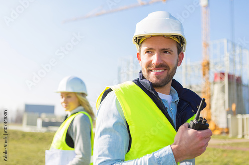 Portrait of a team of two workers on a construction site