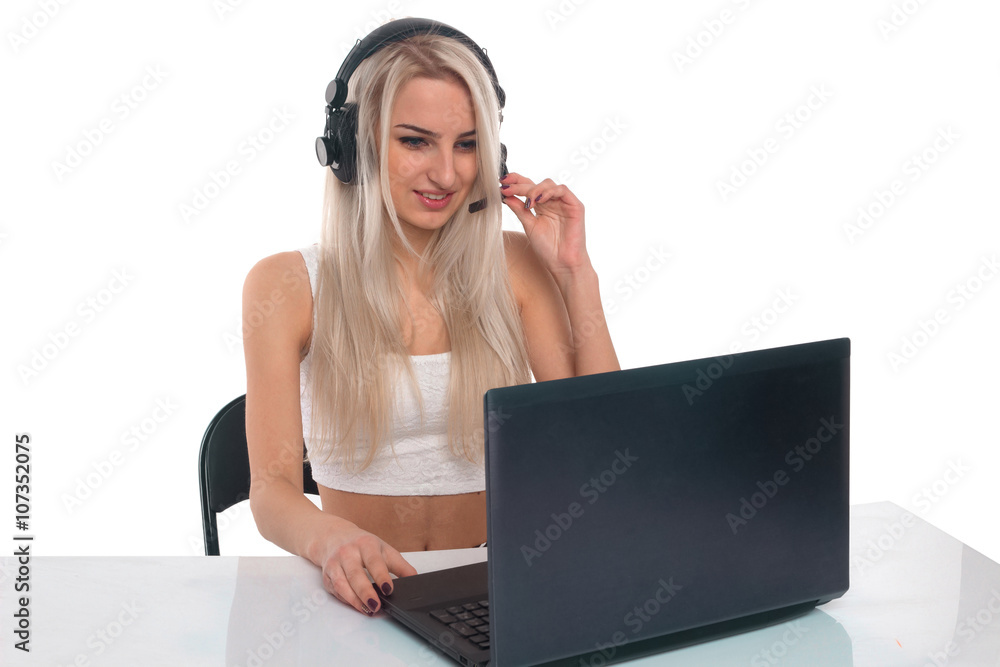 The girl in headphones with laptop The girl in headphones with laptop