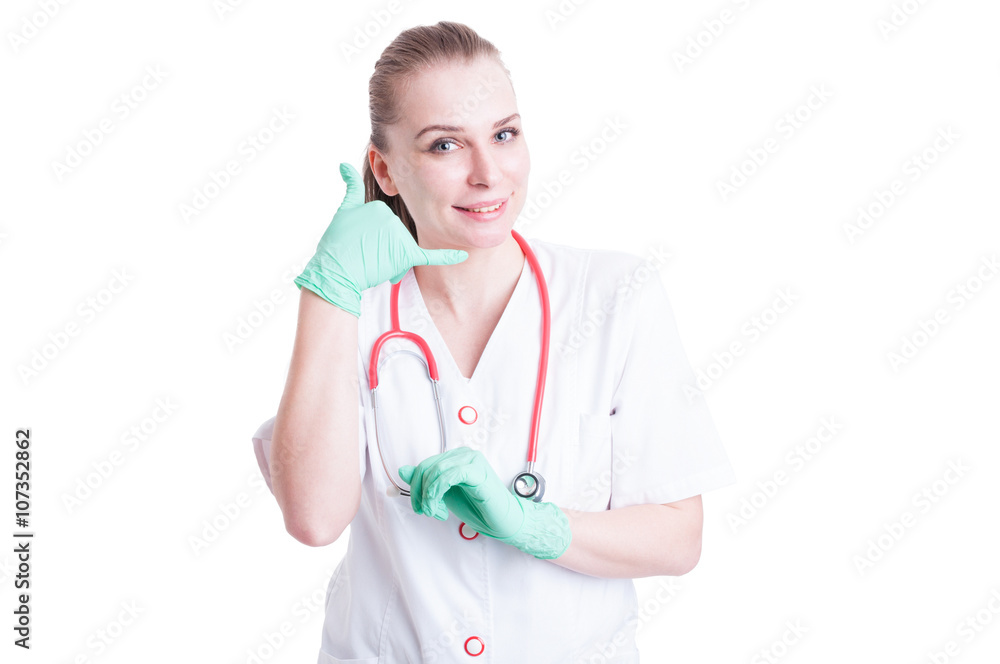 Call me gesture made by cheerful female doctor Call me gesture made by cheerful female doctor