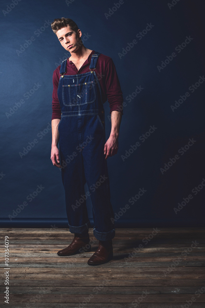 Retro 1950s worker fashion man wearing jeans bib and brace. Stock Photo |  Adobe Stock