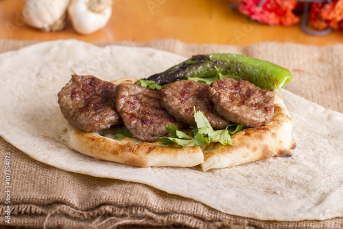 Delicious Turkish Traditional Kebab Kofte with pilaf on white plate (meatballs)