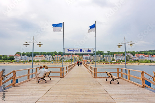 Bansin, Usedom, Germany - June 27, 2012: Pier of the baltic sea spa town Bansin - a famous tourist hotspot. Pier sign labeled with sea spa town Bansin (Seebad Bansin).