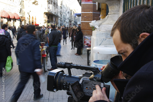 Cameraman working on the street
