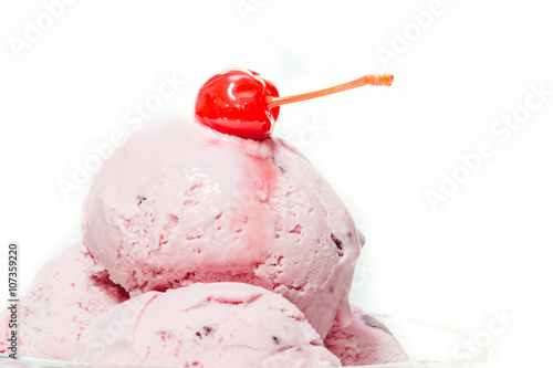 fruit icecream and candied sweet cherries and cherry,isolates,in a cup of ice cream