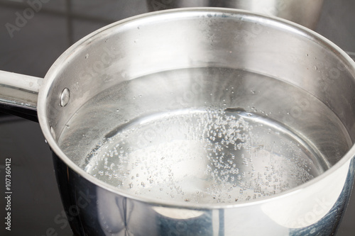 dipper of water on the kitchen stove