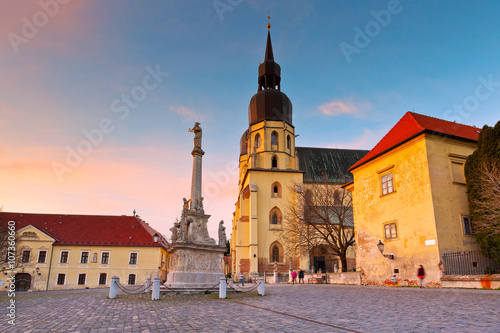 Фотография Monument and a church of saint Nicolaus in centre of Trnava, Slovakia