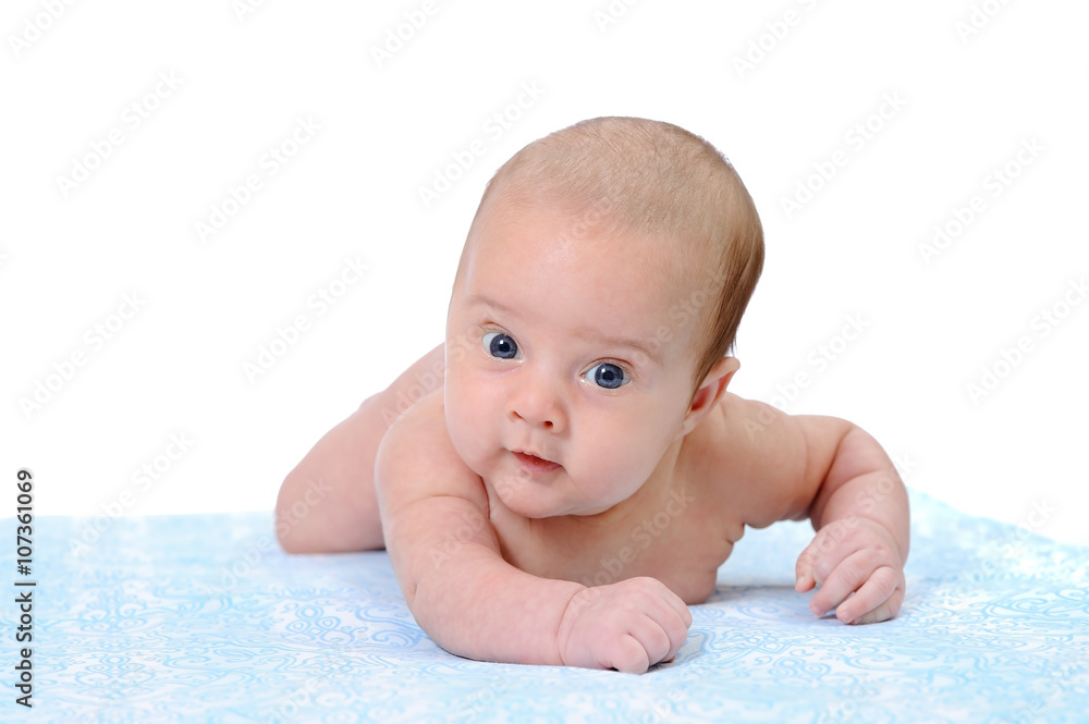 Portrait of a Newborn Baby Trying to Crawl on a Blue Blanket Portrait of a Newborn Baby Trying to Crawl on a Blue Blanket