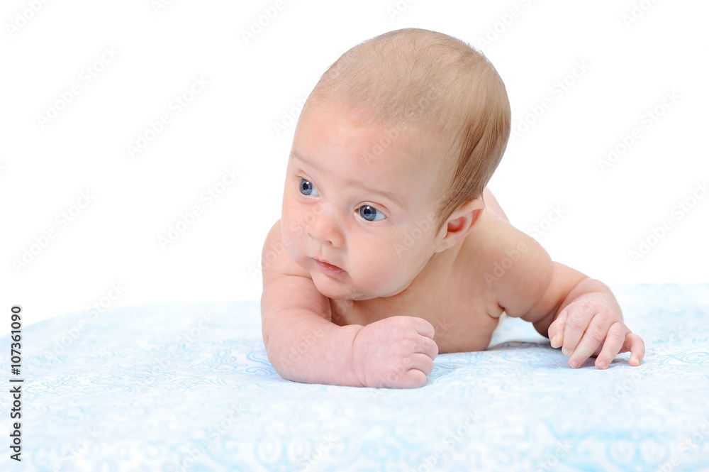 Portrait of a Newborn Baby Trying to Crawl on a Blue Blanket Portrait of a Newborn Baby Trying to Crawl on a Blue Blanket