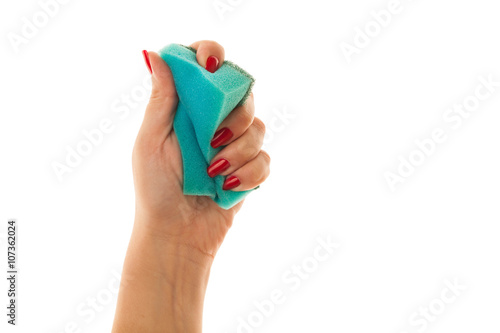 Woman hand holding a cleaning sponge isolated on a white background