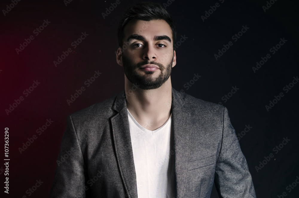 Obraz premium Abstract fashion portrait of handsome man in jacket High contrast