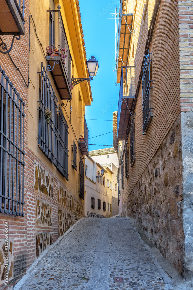 Fototapeta premium Street of the old town in the center of Toledo. Spain