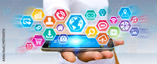 Photos Businessman using digital tactile icons screen