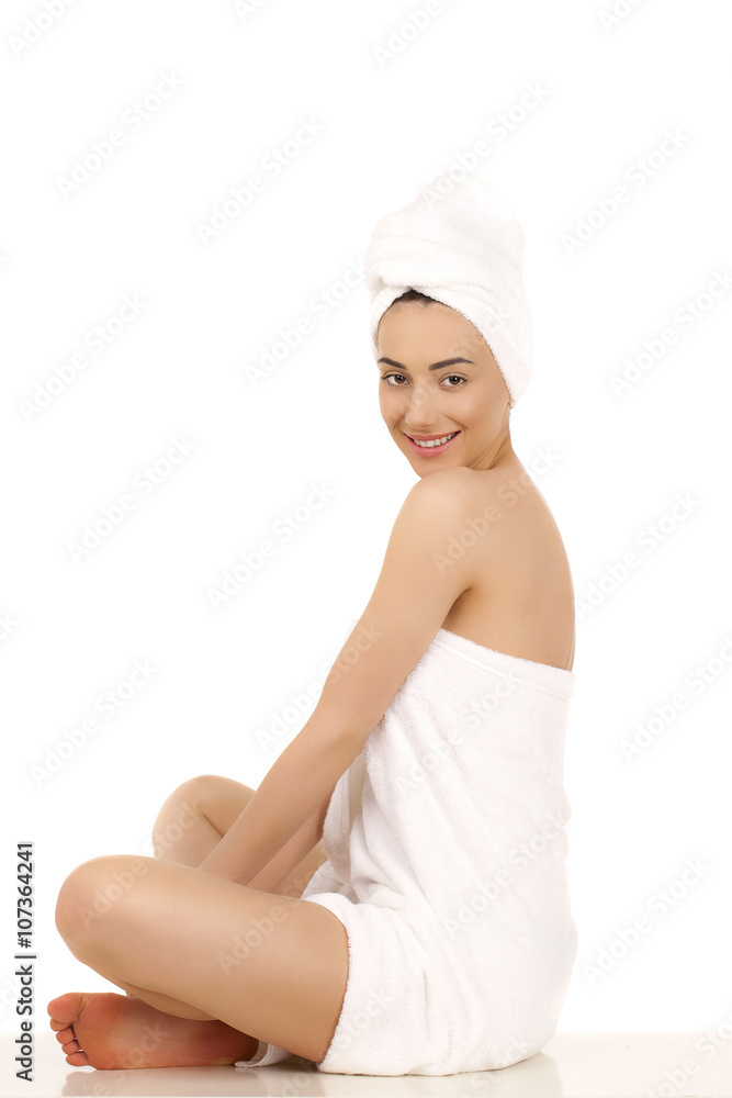 Young woman wrapped towel isolated on white background Young woman wrapped towel isolated on white background
