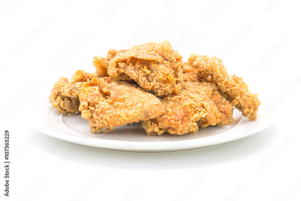 Fried chicken in white plate on white table, on isolate Fried chicken in white plate on white table, on isolate