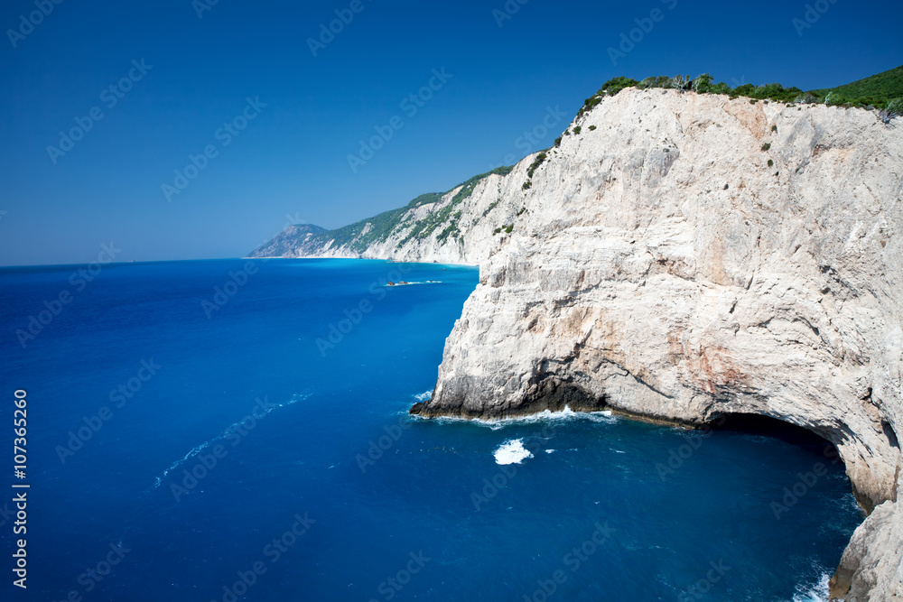 Beautiful landscape of wild island cliffs over a deep blue sea. Beautiful landscape of wild island cliffs over a deep blue sea.