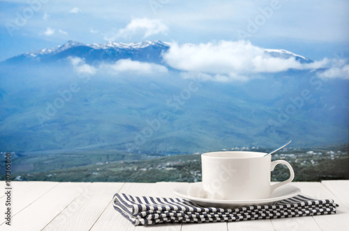 Coffee cup against mountain landscape © Svetlana Lukienko