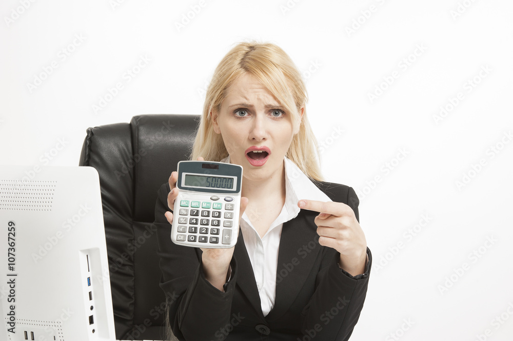 Attractive blonde female accountant with calculator Attractive blonde female accountant with calculator