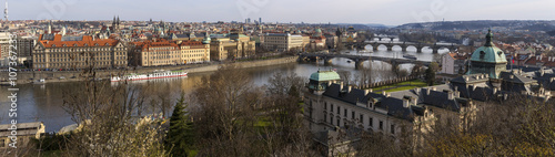 View of the Vltava River and the bridges shined with the sunset sun, Prague, the Czech Republic.