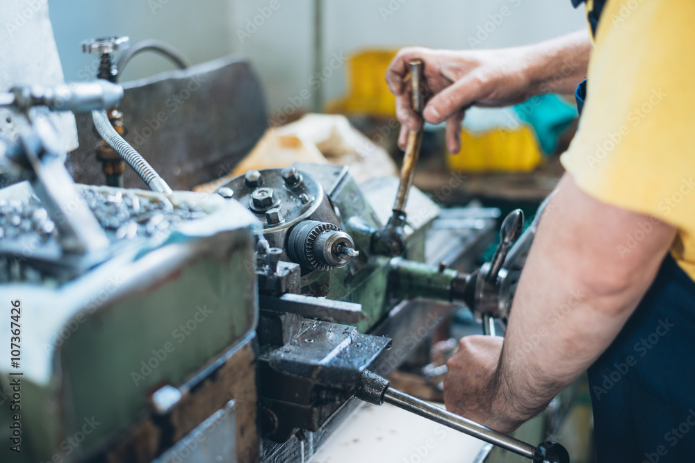 Close up photo of dirty workers hand doing some job on big metalworking machine. Selective focus. Close up photo of dirty workers hand doing some job on big metalworking machine. Selective focus.