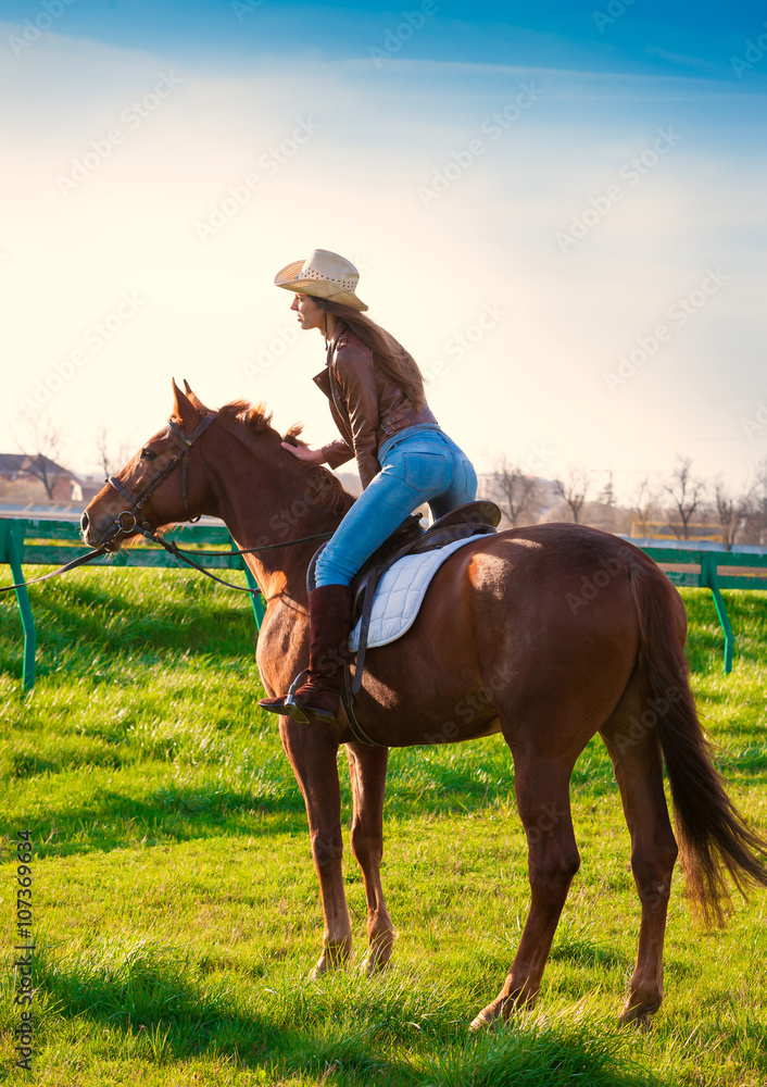 Back woman sitting horse. Day. Back woman sitting horse. Day.