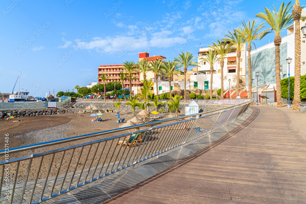 Coastal promenade along a tropical beach in San Juan town on Tenerife, Canary Islands, Spain