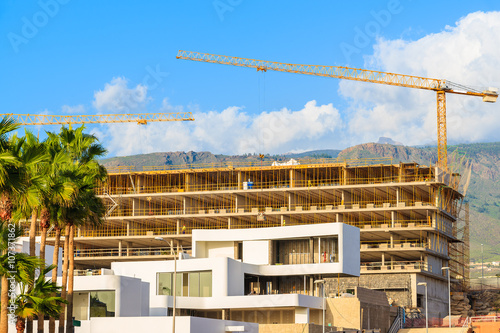Hotel buildings under construction in Costa Adeje town on tropical Tenerife island, Spain © pkazmierczak