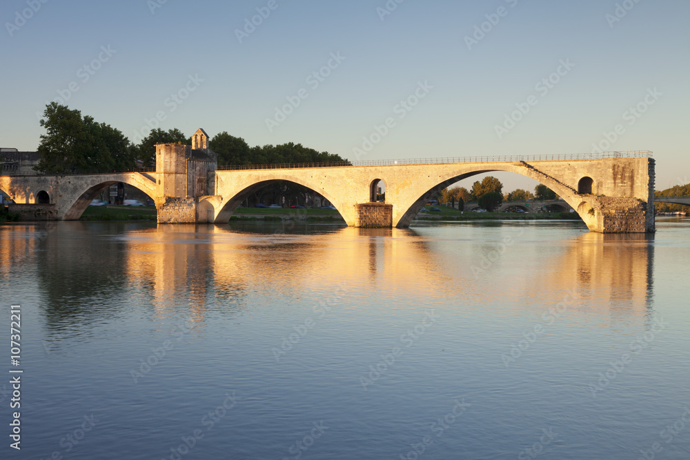 Bridge St. Benezet over Rhone River at sunrise, Avignon, Vaucluse, Provence-Alpes-Cote d'Azur, France Bridge St. Benezet over Rhone River at sunrise, Avignon, Vaucluse, Provence-Alpes-Cote d'Azur, France