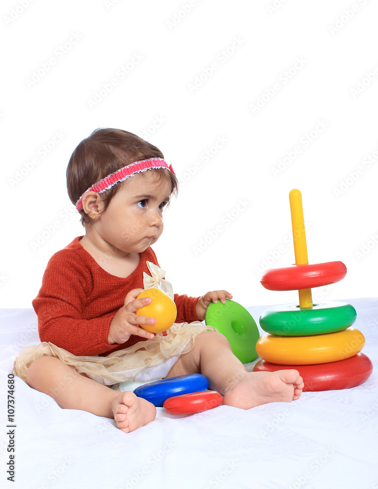 Happy kid playing toy blocks isolated on white background Happy kid playing toy blocks isolated on white background