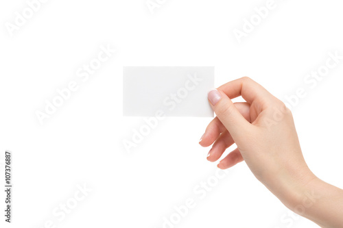 Isolated female hand holds white card on a white background.