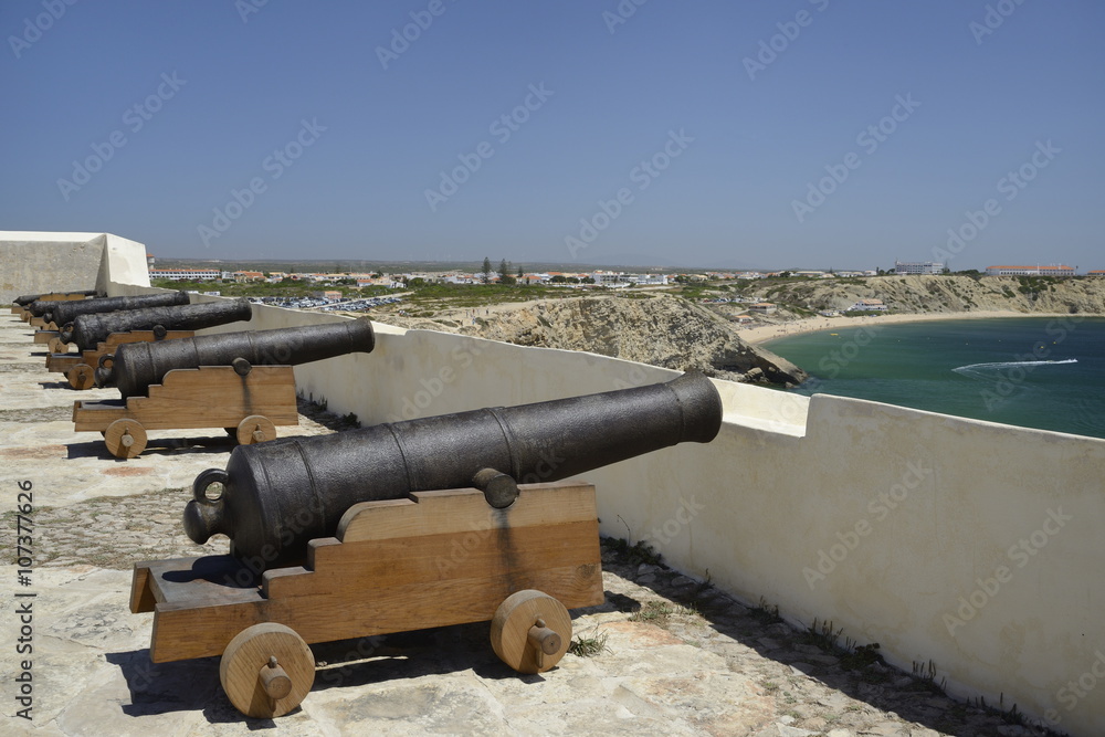 Row of cannons at Sagres fort (Fortaleza de Sagres), Ponta de Sagres, Algarve, Portugal Row of cannons at Sagres fort (Fortaleza de Sagres), Ponta de Sagres, Algarve, Portugal