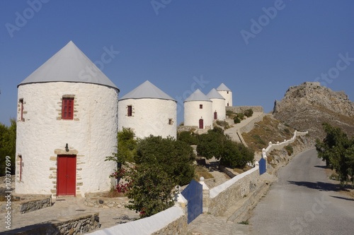 Row of old windmills on Pitiki Hill below Panteli castle, Platanos, Leros, Dodecanese Islands, Greek Islands, Greece photo