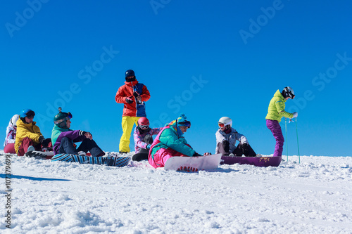 a crowd of young people on a snowy mountain