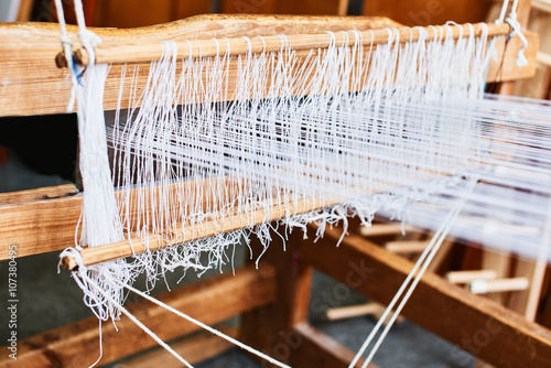 The process of manufacturing textiles on a loom