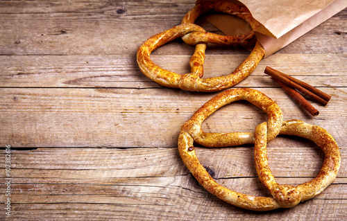 Homemade pastries. Pretzel on wooden background. Food