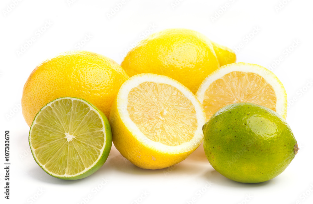Whole and sliced fresh limes and lemons on on white, DOF Whole and sliced fresh limes and lemons on on white, DOF