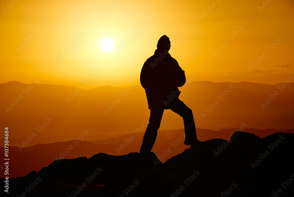 Man on the mountain in the evening