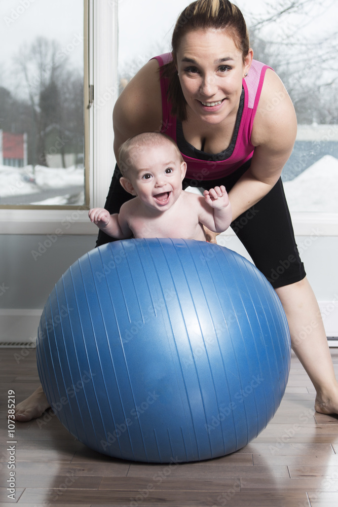 Mother with child boy doing fitness exercises Mother with child boy doing fitness exercises
