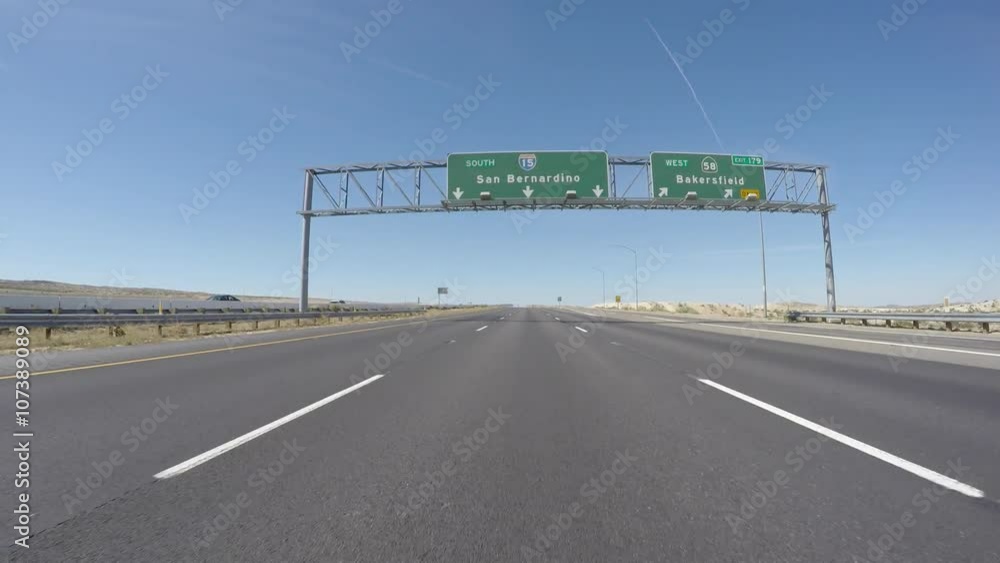 San Bernardino interstate 15 freeway sign driving shot in Southern California. San Bernardino interstate 15 freeway sign driving shot in Southern California.