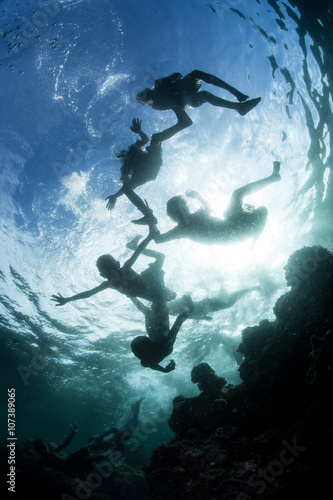 Silhouette of Swimming Children in Solomon Islands