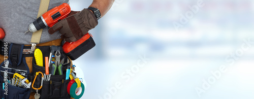 фотографія Builder handyman with a drill.