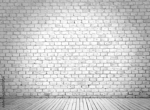 White brick wall and wooden floor
