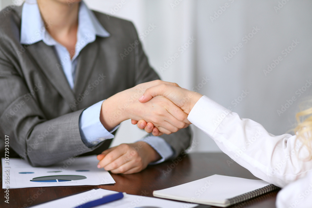Close up of unknown business people handshake Close up of unknown business people handshake
