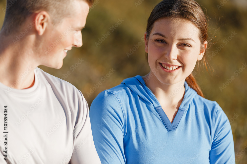 Young couple on beach training together Young couple on beach training together