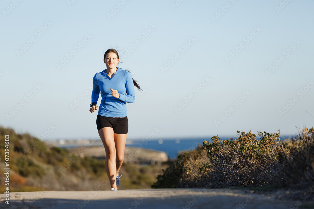 Sport runner jogging on beach working out