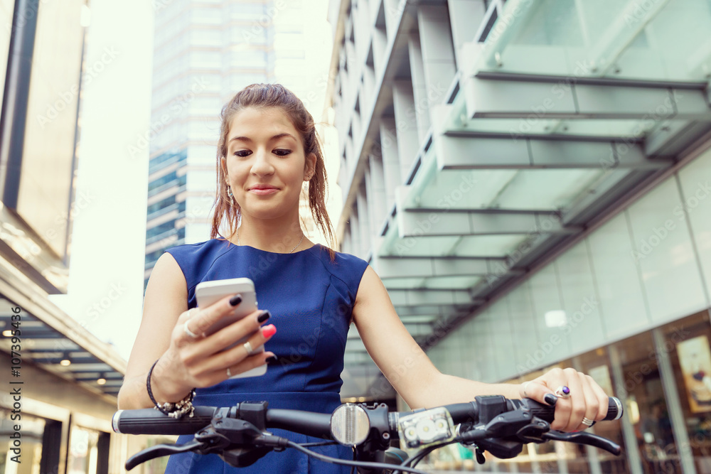 Young woman commuting on bicycle Young woman commuting on bicycle