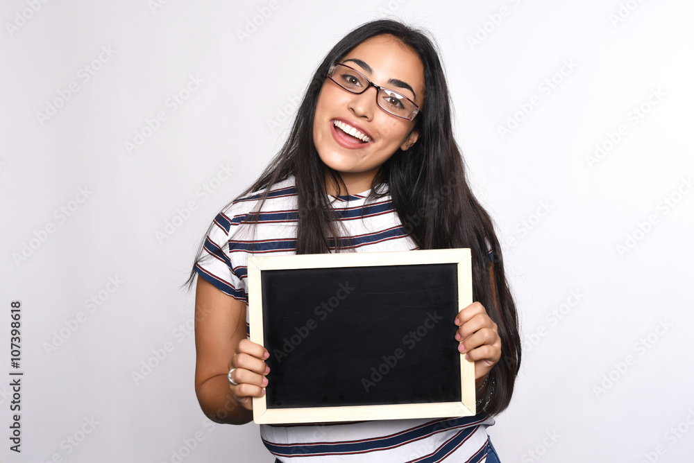 Latin woman holding chalkboard. Latin woman holding chalkboard.