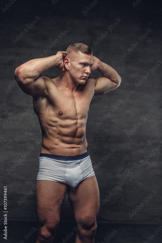 Fototapeta premium Abdominal shirtless man in a white panties.