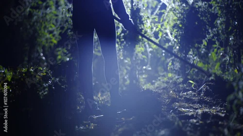 Person walk on garden and start hoeing