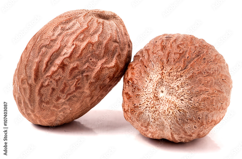 Two nutmeg whole isolated on white background Two nutmeg whole isolated on white background